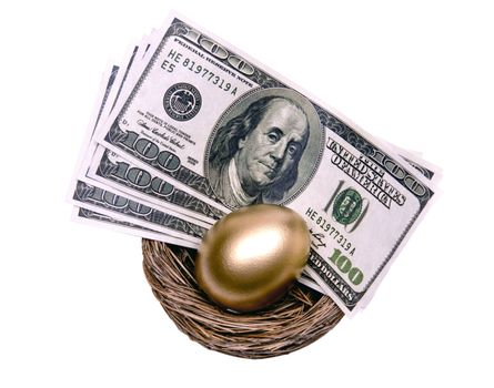 Golden egg resting in nest with money.  American hundred dollar bills.