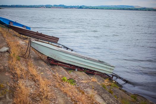 romantic old small boat on shore