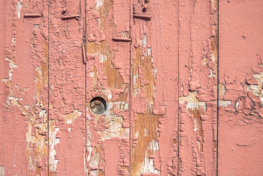 texture of wooden surface with remnants of old paint that has dried and cracked under the influence of weather