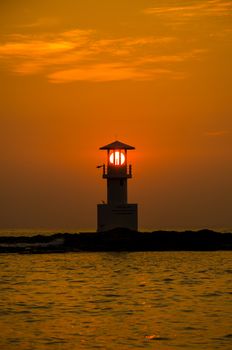 Silhouettes of lighthouse at sunset, Khao Lak, Phangnga Thailand.
