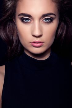 dark beautiful girl portrait with blue eyes