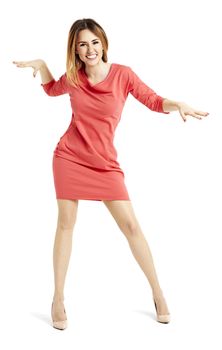 Full length portrait of pretty woman in a red dress. She is dancing.