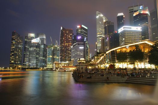 SINGAPORE - APRIL 10,2016: Financial district skyscrapers and the Jubilee Bridge at Merlion Park. A newly created pedestrian bridge at Marina Bay 