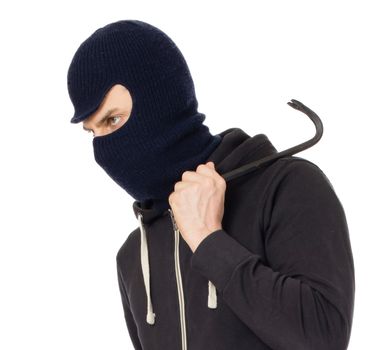 Thief burglar in balaclava mask with metal crowbar