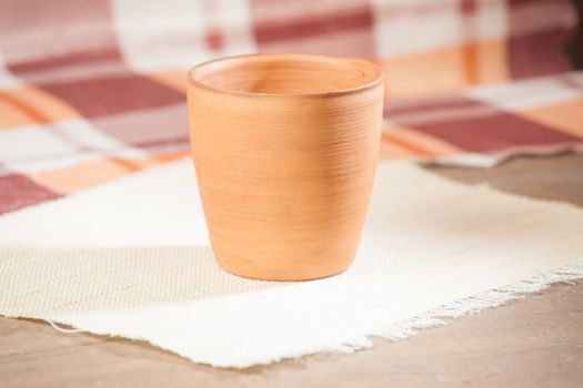 Traditional handcrafted mug on multycolor background. High resolution