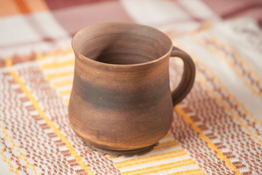 Traditional handcrafted mug on multycolor background. High resolution