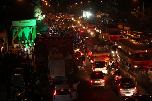 Pune, India - September 27, 2015: Ganesh festival crowds on last day causing traffic jams in India.