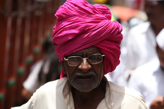 Pune, India - July 11, 2015: An old Indian pilgrim with a traditional headgear