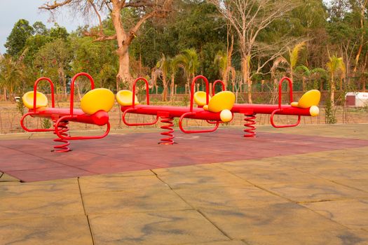 Modern colorful children playground in public park Children playground,seesaw