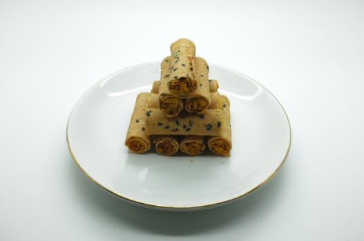 Thai rolled wafer stacking on dish