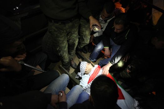 WEST BANK, Bethlehem : Palestinians carry the body of 16-year-old Mamoon Raed Muhammed al-Khatib,and the body of Essam Thawabteh,two young alleged Palestinians attackers whose bodies were held by Israeli forces, in Bethlehem on December 27, 2015. Since a wave of unrest swept the occupied Palestinian territory at the beginning of October 2015, Israel has routinely held the bodies of Palestinians it alleges were attempting to attack Israelis when they were killed. Israel turned over to the Palestinian Authority the bodies of seven alleged Palestinians attackers on December 26, 2015. 
