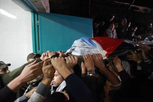 WEST BANK, Bethlehem : Palestinians carry the body of 16-year-old Mamoon Raed Muhammed al-Khatib,and the body of Essam Thawabteh,two young alleged Palestinians attackers whose bodies were held by Israeli forces, in Bethlehem on December 27, 2015. Since a wave of unrest swept the occupied Palestinian territory at the beginning of October 2015, Israel has routinely held the bodies of Palestinians it alleges were attempting to attack Israelis when they were killed. Israel turned over to the Palestinian Authority the bodies of seven alleged Palestinians attackers on December 26, 2015. 
