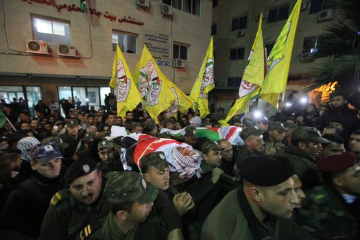 WEST BANK, Bethlehem : Palestinians carry the body of 16-year-old Mamoon Raed Muhammed al-Khatib,and the body of Essam Thawabteh,two young alleged Palestinians attackers whose bodies were held by Israeli forces, in Bethlehem on December 27, 2015. Since a wave of unrest swept the occupied Palestinian territory at the beginning of October 2015, Israel has routinely held the bodies of Palestinians it alleges were attempting to attack Israelis when they were killed. Israel turned over to the Palestinian Authority the bodies of seven alleged Palestinians attackers on December 26, 2015. 