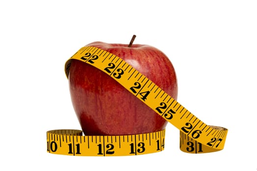 Red apple and yellow tape measure on white background
