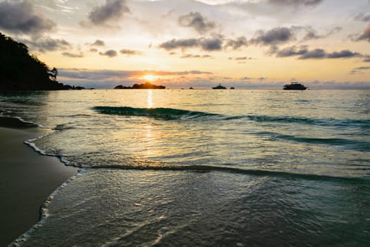 Beautiful landscape morning sky over the sea and beach at Honeymoon Bay during sunrise is a famous attractions for diving on Miang island in Mu Koh Similan National Park, Phang Nga Province, Thailand