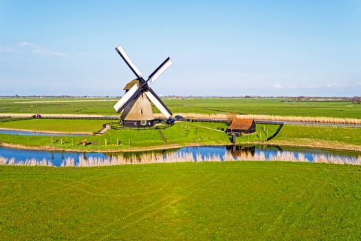 Aerial from a traditional ancient windmill in the countryside from the Netherlands