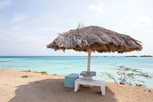 Beach umbrella on Palm Beach in Aruba Caribbean