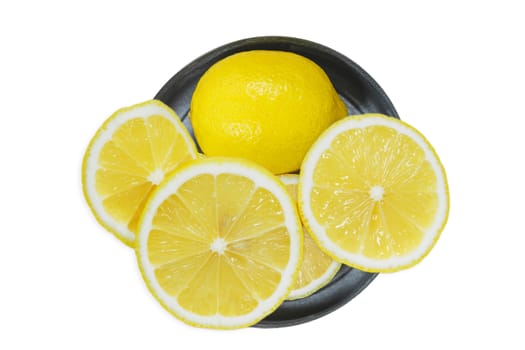 Sliced lemons with knife isolated on white background.