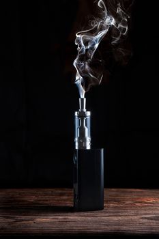 electronic cigarette over a dark background close up