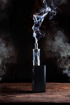 electronic cigarette over a dark background close up