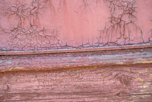 texture of wooden surface with remnants of old paint that has dried and cracked under the influence of weather