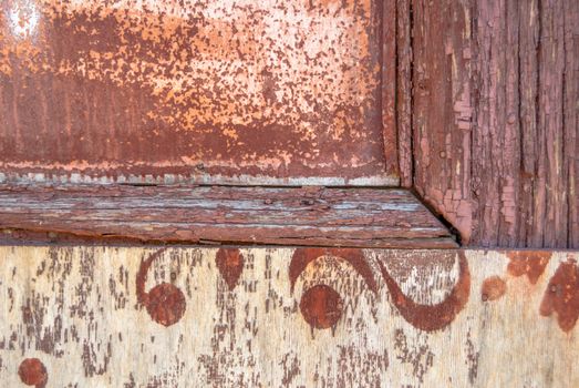 texture of wooden surface with remnants of old paint that has dried and cracked under the influence of weather