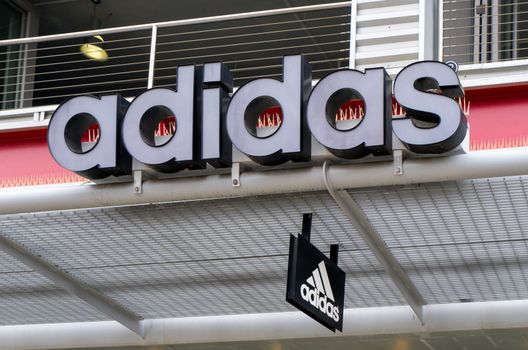 SANTA MONICA, CA/USA - MAY 12, 2016: Adidas retail store exterior and logo. Adidas is a German multinational corporation that designs and manufactures sports shoes, clothing and accessories.
