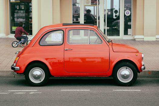 Menton, France - May 14, 2016: Small Italian car Fiat 500 Parked in a Parking Lot in Menton. Red Fiat 500 R