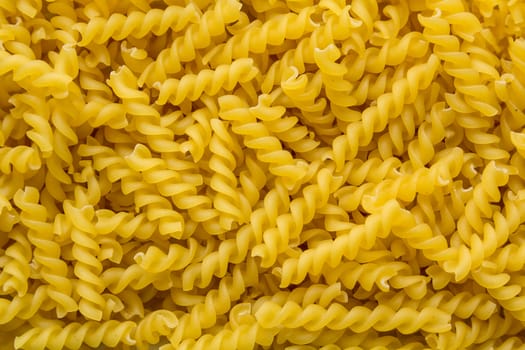 dry curly egg noodles close-up background