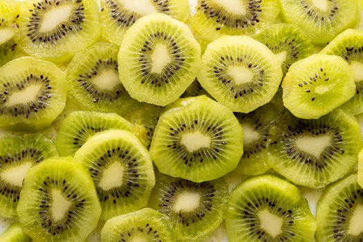 Fresh organic Kiwi Fruit Slices arranged showing the pips & structure