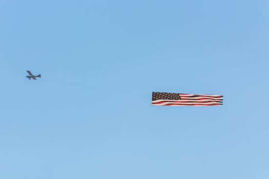 Banner towing, small engine aircraft towing banners for advertising.