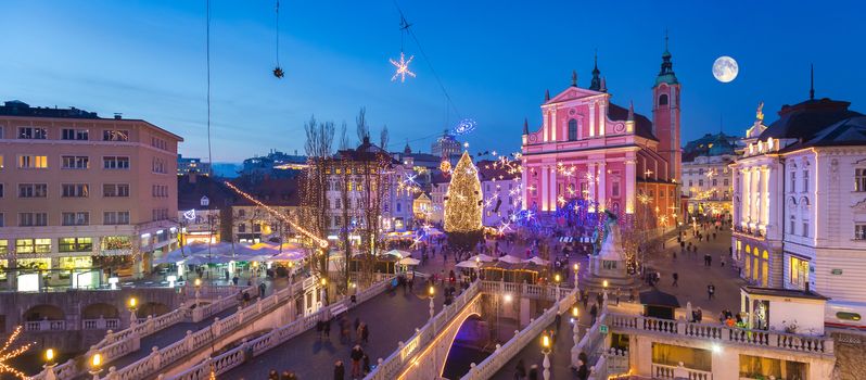 Romantic Ljubljana's city center decorated for Christmas holiday. Preseren's square, Ljubljana, Slovenia, Europe. Panoramic view.