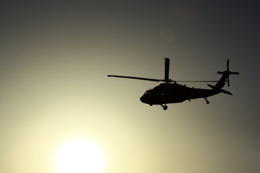 Helicopter at sunset with sun view