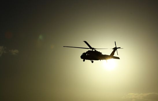 Helicopter at sunset with sun view