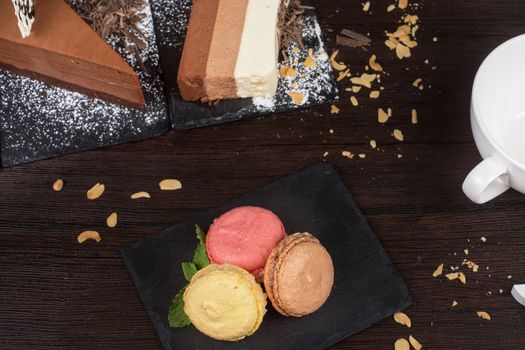 Table with cakes ans coffee cup