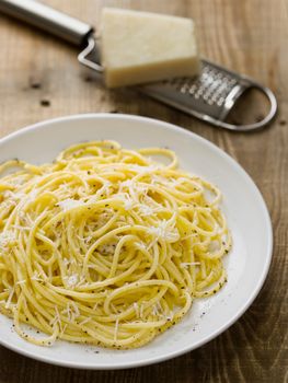 close up of rustic italian pepe e cacio pepper with cheese spaghetti