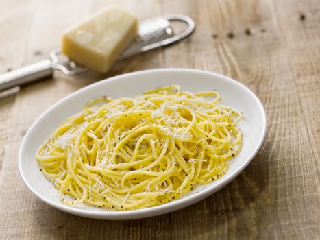 close up of rustic italian pepe e cacio pepper with cheese spaghetti