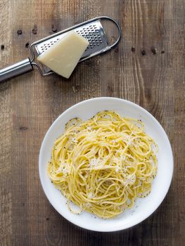 close up of rustic italian pepe e cacio pepper with cheese spaghetti