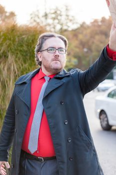 A young businessman with glasses in a urban scene