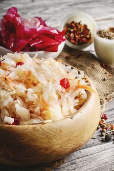 sauerkraut with spices and carrots in a wooden tub
