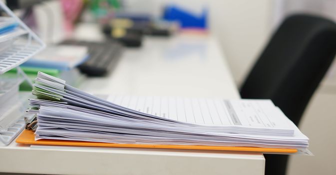 Data of work and office supplies were arranged on desk.