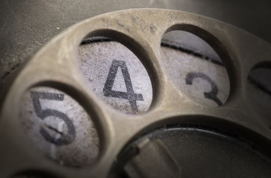 Close up of Vintage phone dial, dirty and scratched - 4, perspective