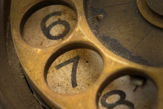 Close up of Vintage phone dial, dirty and scratched - 7, perspective