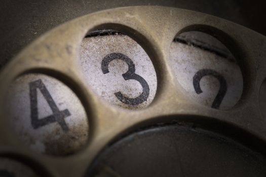 Close up of Vintage phone dial, dirty and scratched - 3, perspective