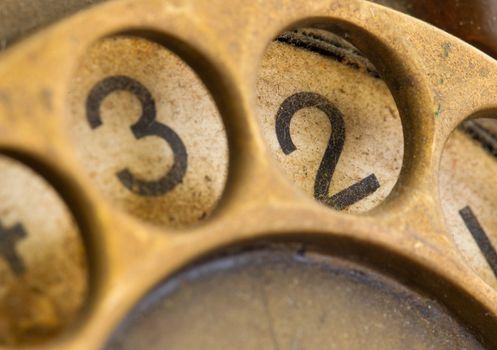 Close up of Vintage phone dial, dirty and scratched - 2, perspective