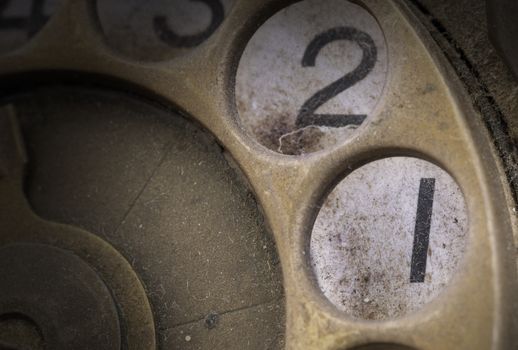 Close up of Vintage phone dial, dirty and scratched - 1, perspective