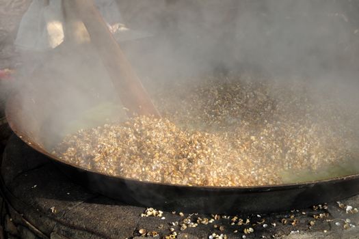 process mussel, cook seafood in boil water then sift mussel pulp from sell, mussel is famous food in Hoian, Vietnam