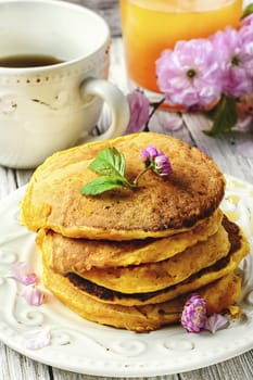 Pumpkin pancakes,tulips in a stylish wooden tray
