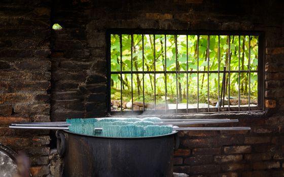 Natural wool dyeing in a carpet factory, Nepal