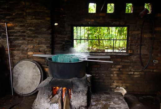 Natural wool dyeing in a carpet factory, Nepal